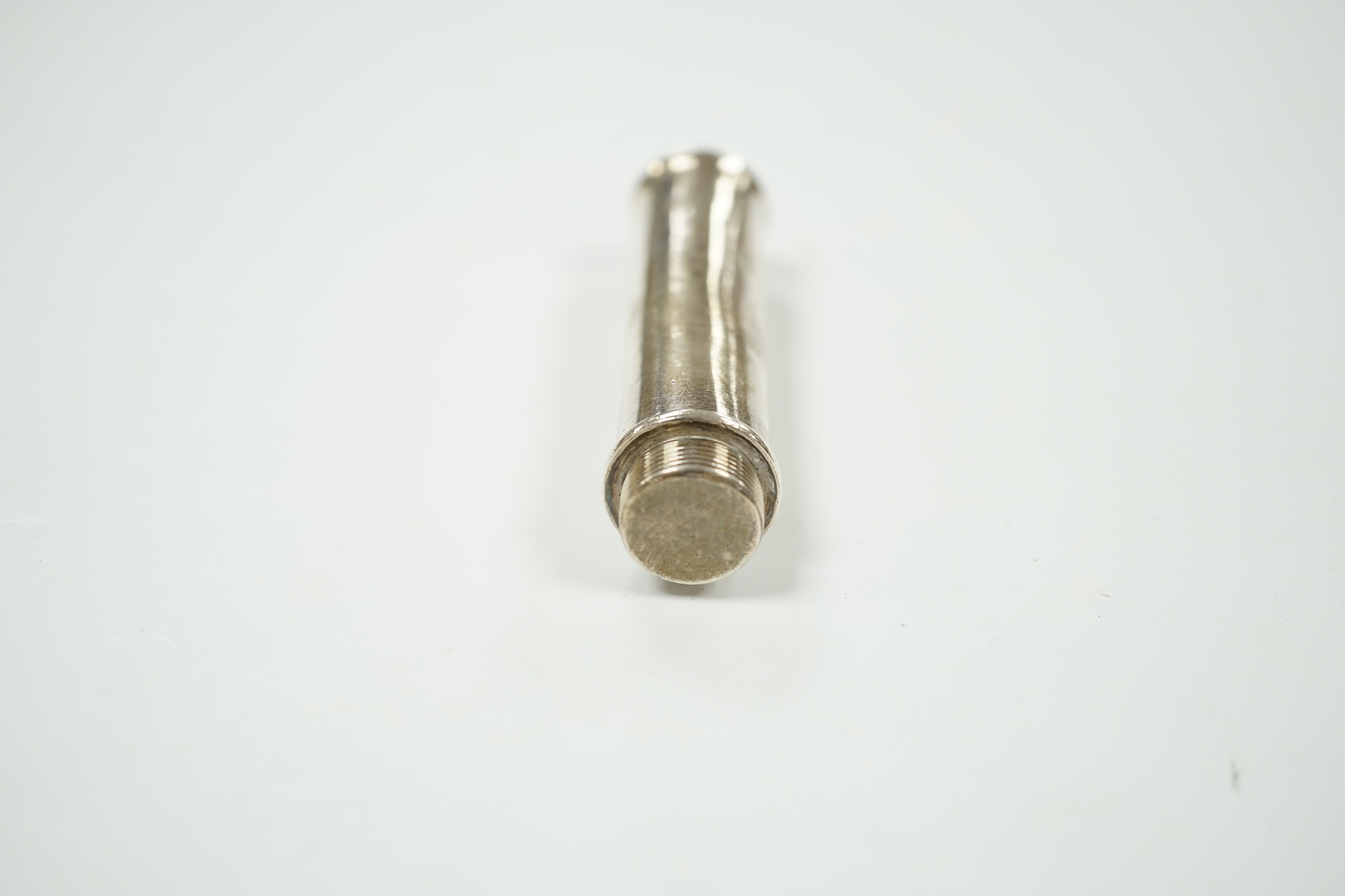 A George III silver travelling apple corer, George Knight, London, 1818, 84mm.
